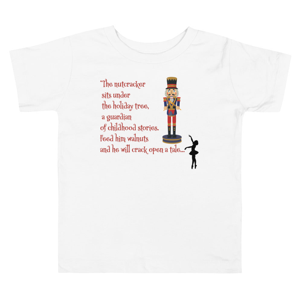 The Nutcracker Sits Under The Holiday Tree, A Guardian Of Childhood Stores. Feed Him Walnuts And He Will Crack Open a Tale... Short Sleeve T Shirts For Toddlers And Kids. - TeesForToddlersandKids -  t-shirt - christmas, holidays - the-nutcracker-sits-under-the-holiday-tree-a-guardian-of-childhood-stores-feed-him-walnuts-and-he-will-crack-open-a-tale-short-sleeve-t-shirts-for-toddlers-and-kids