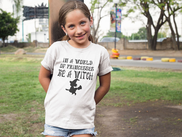 In A World Of Princesses Be A Witch.          Halloween shirt toddler. Trick or treat shirt for toddlers. Spooky season. Fall shirt kids.
